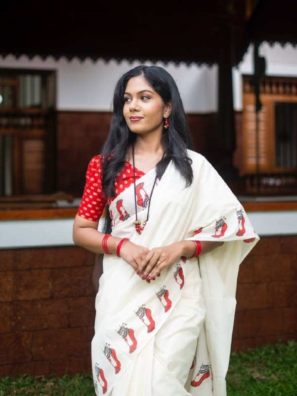 Malabar Heritage Ivory Saree with Red Geometric Border & Traditional Motif Design