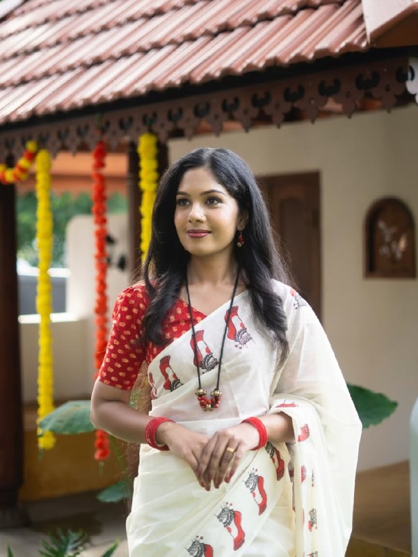 Malabar Heritage Ivory Saree with Red Geometric Border & Traditional Motif Design