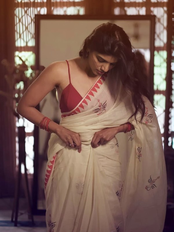 Malabar Heritage Ivory Saree with Red Geometric Border & Traditional Motif Design