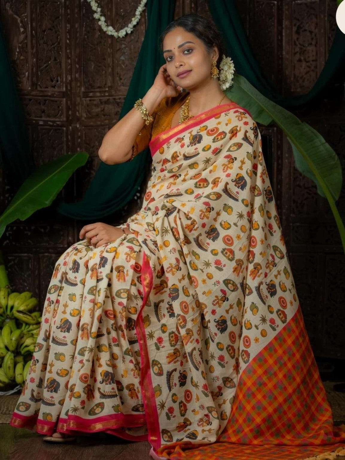 Cream saree showing multicolour traditional motifs and checked pallu