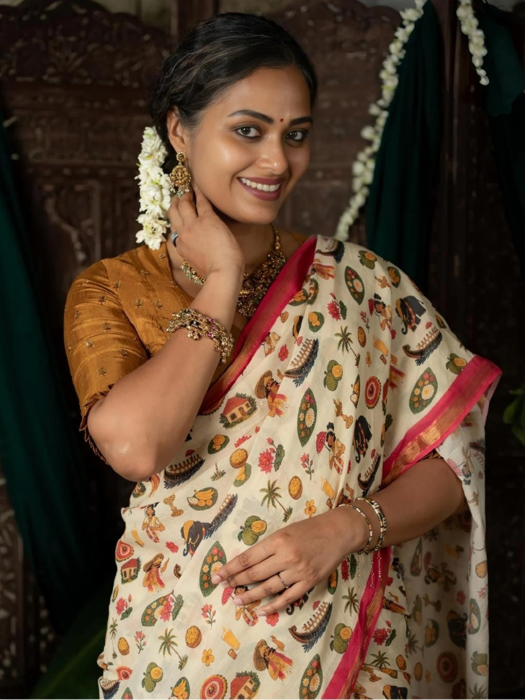 Close-up of cream saree print and pink gold border