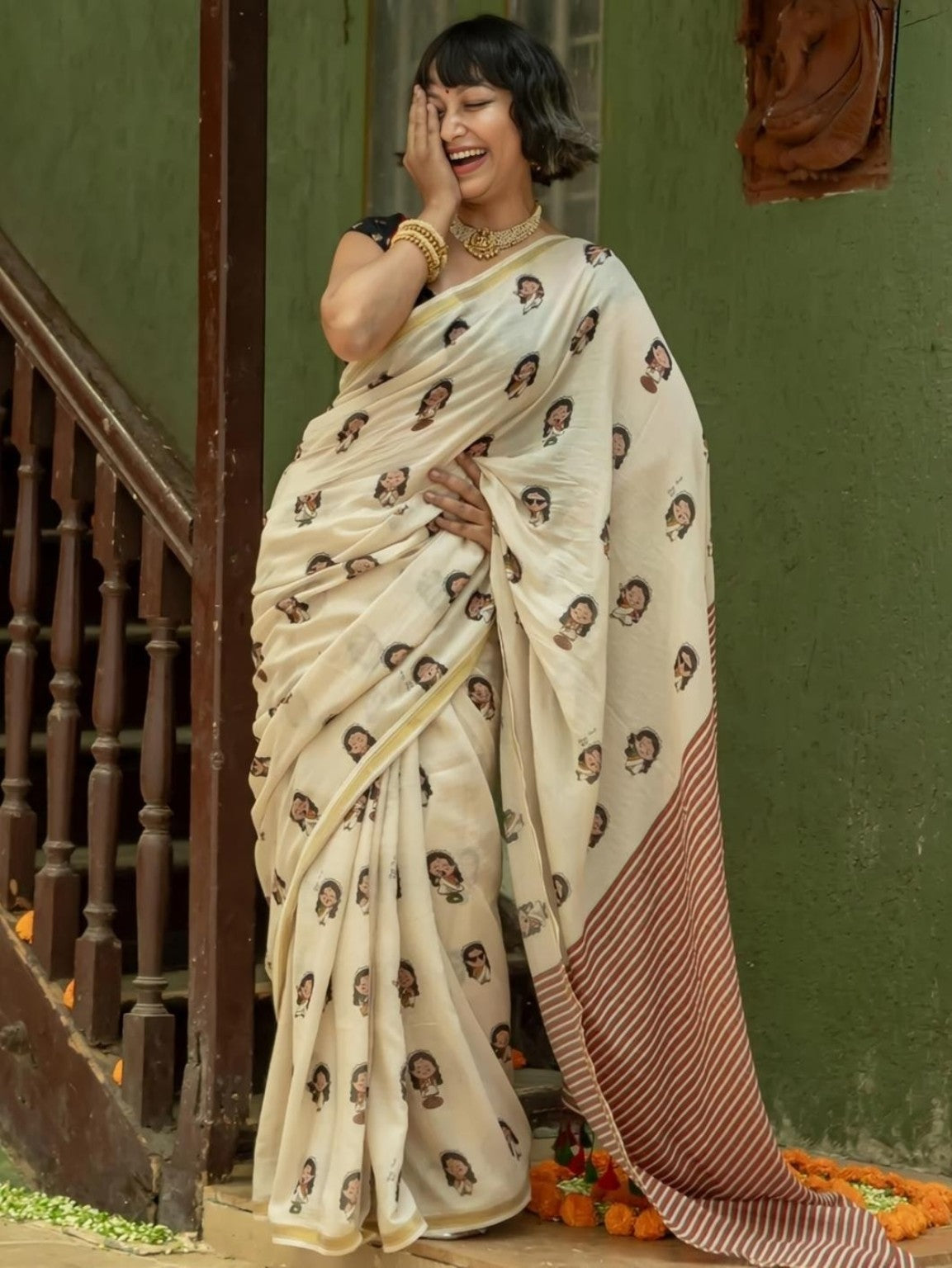 Cream saree with illustrated girl print and matching striped pallu