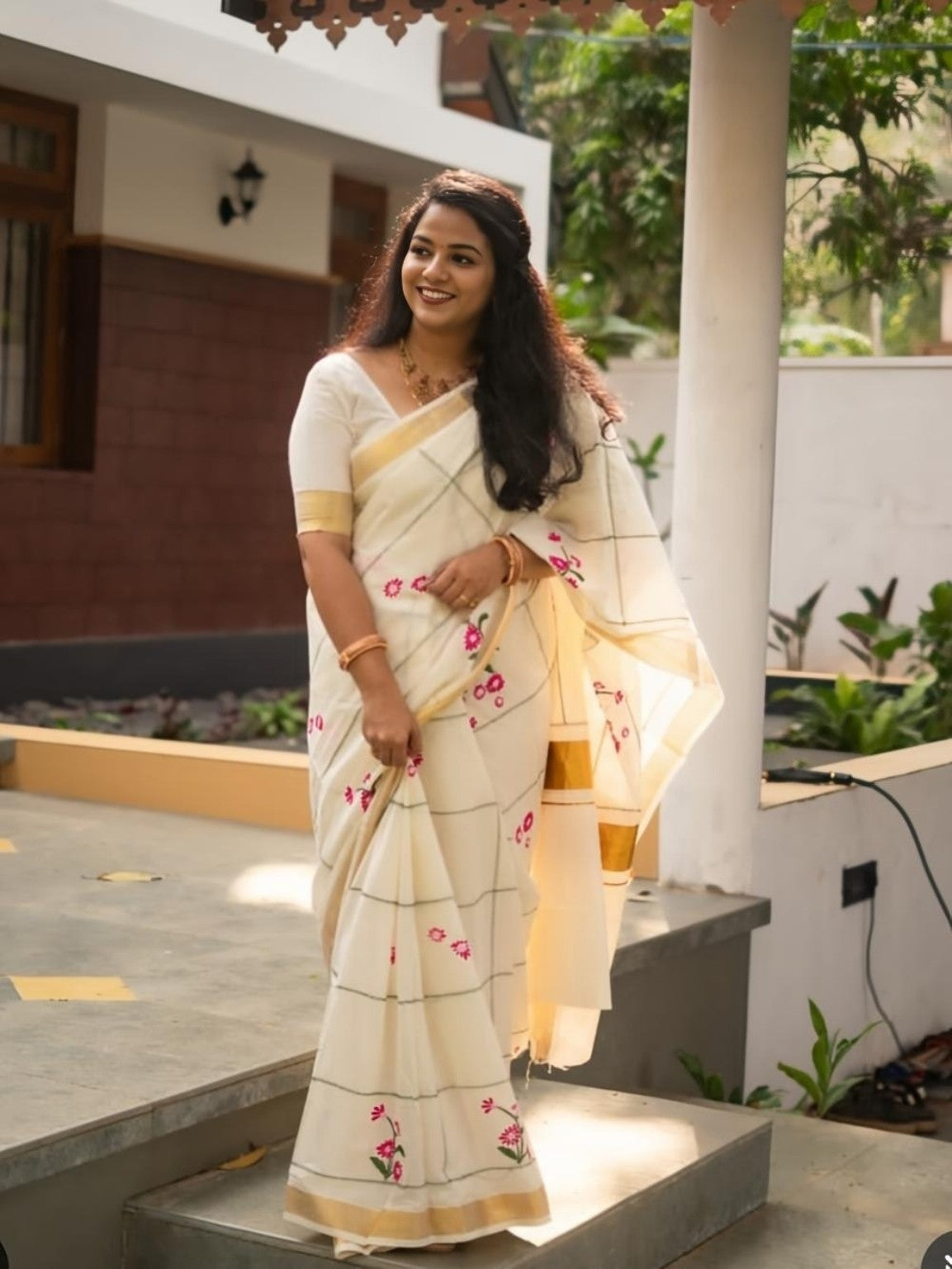 Cream saree with pink floral digital print and gold pallu border