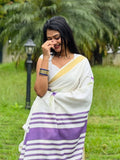 White linen saree with purple lotus digital print and gold zari border