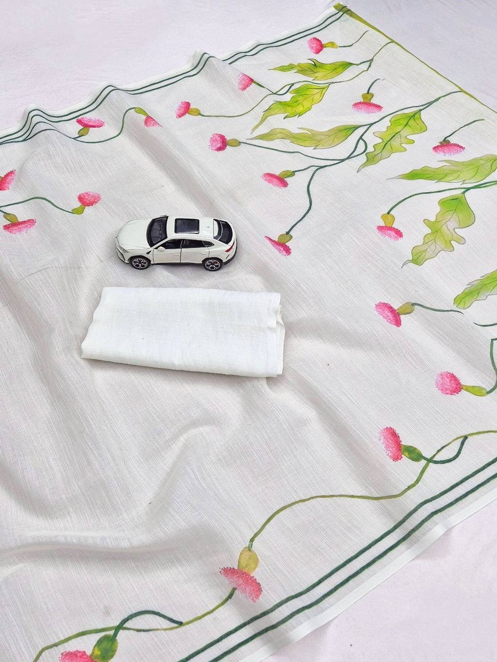 Ivory saree with pink floral buds and green leafy digital print